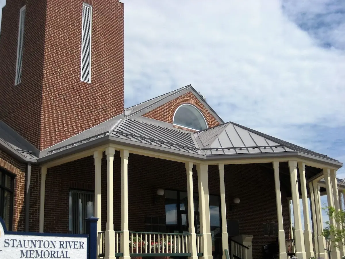 Skilled roofing craftsmen working on a residential roof in Fort Rucker